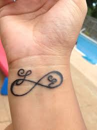 They are usually tiny and subtle but carry a lot of meanings. Pin By Melissa Bliss On Tattoos Kids Initial Tattoos Wrist Tattoos For Women Initial Tattoo