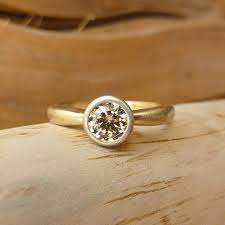 5 Beautiful Alternative Engagement Ring Stones If You Re On A Budget In 2020 White Diamond Rings Engagement Champagne Diamond White Gold Rings