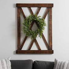 Your walls are waiting we can match you up with art you'll love, help create a home gallery, and even provide assistance getting it on the wall. Dark Walnut X Frame Wood Wall Plaque With Wreath Kirklands