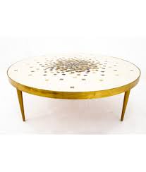 Take a low coffee table which features an insert. Martz Style Mid Century Round Brass Mosaic Tile Coffee Table