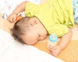 Baby Hand Hand Holding Milk Bottle While Sleeping Stock Photo Picture And Royalty Free Image Image 46623405