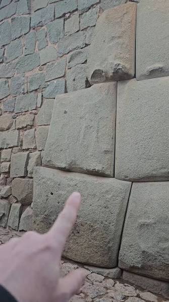 The famous megalithic wall at Sacsayhuamán in Cusco, Peru is built from massive stone blocks, some estimated to weigh more than 100 to 120 tons. The walls were built using irregularly shaped