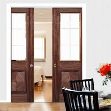 Hdf door skin+finger joint plank+honeycomb filling. Double Pocket Valencia Walnut Door With Lacquer Finishing And Frosted Safety Glass With Clear Bevel Edges Elegantdoors Lpdd Pocket Doors Elegant Doors Doors