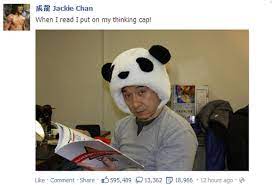Jackie Chan Reads Wearing A Panda Head Hat Jackie Chan Jackie Celebrities Reading