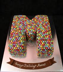 Find different variety of cake like : Letter M Smarties Cake Smarties Cake Cake Lettering Happy Birthday Cakes