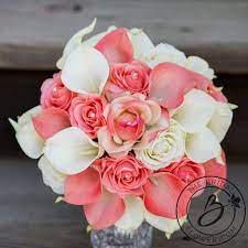 This cote designs bouquet contained only white calla lilies with leafy greenery for color. Coral And Ivory Bouquet Artificial Flowers Calla Lilies In Coral And Ivory Roses In Flower Bouquet Wedding Coral Bouquet Wedding Calla Lilly Wedding Bouquet