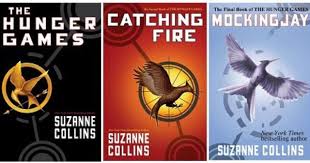 Book 1 The Hunger Games Book 2 Catching Fire Book 3 Mockingjay In A Not Too Distant Future T Hunger Games Books The Hunger Games Books Book Worth Reading