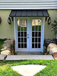 The Bronze Metal Concave Door Awning In Paterson Nj Door Awnings Awning Over Door Custom Awnings