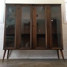 Broyhill lighted curio cabinet (2 removal glass shelves with storage underneath). Mid Century Modern Glass Fronted Walnut Display Cabinet Broyhill Saga Epoch