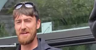 Distressed' toddler sat in back of car while man repeatedly punched her dad  through the window