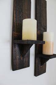 From installing simple iron candle wall decor to hanging up extravagant rembrandt paintings, the next step in adding class to your even when you find no need to use candles, these wall sconces provide a definitively classy touch to any room or corridor. Pallet Candle Sconces The Diy Life