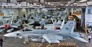 Check Out The Crowded Hangar Bay Aboard The Carrier Uss Dwight D Eisenhower Aircraft Navy Aircraft Carrier Aircraft Carrier