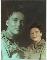 Portrait of army nurse Diane Kay Corcoran attired in Vietnam-era olive drab  army field uniform.