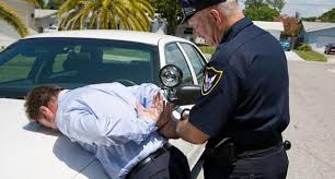 Police Officer Handcuffing Suspect Shutterstock Do You Kn Police Police Officer Arrested Criminal Defense