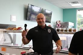 Officers scoop ice cream to fundraise • Current Publishing