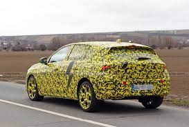 The new astra will have production. 2022 Opel Astra Makes Spy Debut With A Not So Subtle Yellow Camo Wrap Carscoops