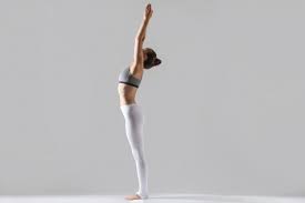 Download Young Woman In Tadasana Pose Grey Studio Background For Free Yoga Poses Mountain Pose Hatha Yoga Poses