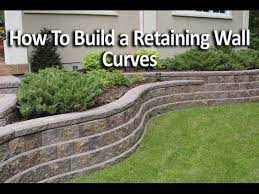 Concrete retaining wall footing size. How To Build Retaining Wall With Curves Youtube