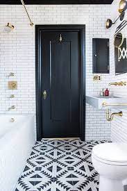 Warm tones and grey flooring adds to the aesthetic of an elegant bathroom design. 15 Bathrooms With Amazing Tile Flooring