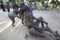 Rohingya Refugees From Myanmar In Bangladesh Boy Play On A Homemade Scooter Unhcr S Kritsanavarin Beauty Of Boys Street Kids Boys Playing