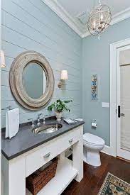 A wave pattern shower curtain sets the. Blue Grey Paneled Wall White Mirror Eclectic Bathroom Small Cottage Bathrooms Bathroom Vanity Remodel