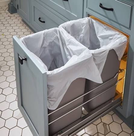 Our built-in kitchen dustbin cabinet designs keep waste hidden, hygiene  intact, and your kitchen looking sleek and organized. Smooth pull-out  mechanisms, space-saving layouts, and designs that blend seamlessly with  modern modular kitchens. #