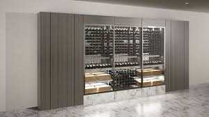 The float wine display system uses architectural cables & glass to suspend wine bottles, neck or label forward. Wine Cellar Specialists Cable Wine Systems