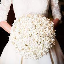 You hold the stephanotis bloom gently between your fingers, taking care not to squeeze too hard. Stephanotis Bridal Bouquet Bridal Bouquet White Bridal Bouquet Stephanotis Bridal Bouquet