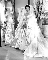 Vogue delves into the history of the white wedding dress, from its origins in victorian england, popularised by hollywood and royalty, to being the ultimate fashion show finale. Elizabeth Taylor Wedding Dress History Famous Wedding Dresses Wedding Movies
