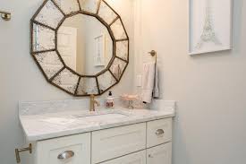 Here, a mini tower is placed in the center of a double vanity which looks so chic. Bathroom Vanity With Center Tower Design Ideas