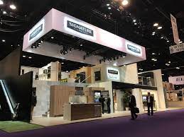 Large Trade Show Hanging Sign With Truss Supports And Overhead Lighting Hanging Signs Hanging Truss Structure