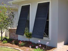 Close Up View Of A Pair Of Black Bahama Style Hurricane Shutters Shutters Exterior Outdoor Shutters Hurricane Shutters