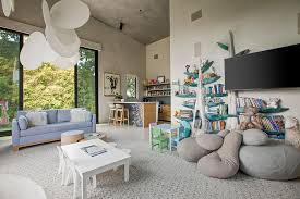 The playroom is a part of the kid's bedroom and hence, there wasn't any choice to keep the study or activity table against the wall as a bed is already occupying that space. 14 Jaw Dropping Celebrity Playrooms Amanda Holden Elton John Vogue Williams More Hello