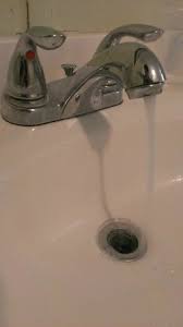 bathroom sink. old shower head