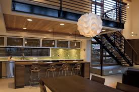 The trick is using a dark color on the bottom and a lighter color on top. Open Kitchen Designs