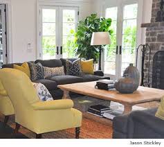 For a contemporary, neutral palette, add a pair of gray accent chairs to your decor. Color Me Happy The Funky Bear Yellow Living Room Living Room Decor Gray Living Room Grey