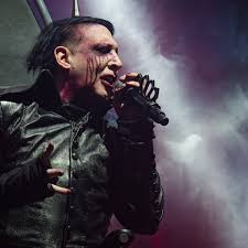 Marilyn manson and daisy berkowitz formed marilyn manson & the spooky kids in december 1989, adding olivia newton bundy to complete the band's first lineup. Marilyn Manson Review Escapist Vaudeville For An Age Of Real Life Horror Marilyn Manson The Guardian