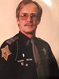 This afternoon Officer Noah Pollert, Floyd County Police had the privilege  to take former officer Nobby Bostock in one more ride in a Floyd County  Police car to his final resting place.