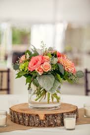 And to get started on my wood slice journey, i just took a few and stacked them up to make a centerpiece in the family room. Rustic Wood Slab Centerpieces Into Your Wedding Amazing Wedding Centerpieces Rustic Wedding Centerpieces Wedding Centerpieces