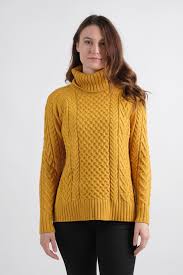 •slim fit cable knit body hits at mid thigh, long sleeves and pockets front. Alison Sheri Cowl Neck Cable Knit Sweater Bellissima