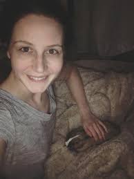 Labrador retriever playing in mud at the barn