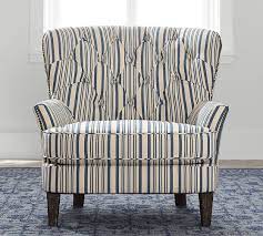 Rh's nailhead fabric armchair:handcrafted with an oak frame and solid oak legs, our dining chair features plush padding and crisply tailored upholstery. Cardiff Upholstered Tufted Armchair With Nailhead Antique Stripe Pottery Barn