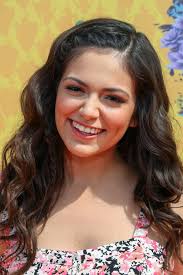 Senses of nature, innocence, and romance are embodied in a braided hairstyle. Bethany Mota Wavy Medium Brown Crown Braid Mini Braids Hairstyle Steal Her Style