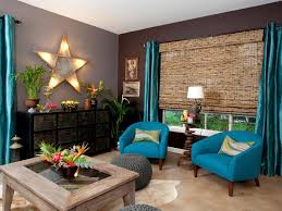On a lot of adornment shows, these are the first things to determine if you want a formal living room or more of a family room feel. Gray Living Room With With Rustic Table And Blue Vintage Side Chairs Hgtv