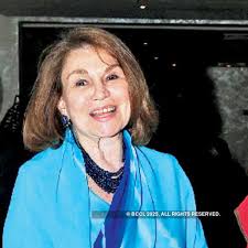 George Michell snapped with a guest during a book launch, held at a star  hotel in the city recently