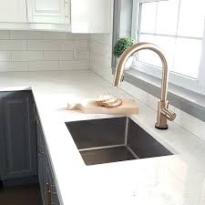 a gold kitchen faucet by delta