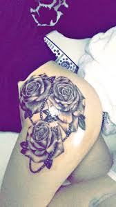 Thigh Tattoo Roses And Pearls Rose Tattoos Thigh Tattoos Women Pearl Tattoo