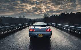 If you're looking for the best nissan skyline r34 wallpaper then wallpapertag is the place to be. Car Nissan Nissan Skyline Gt R R34 Blue Cars Rain Trees Sky Hd Wallpapers Desktop And Mobile Images Photos