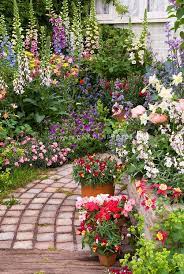Stone Garden Path With Lush Flower Garden Plant Flower Stock Photography Gardenphotos C Small Flower Gardens Flower Garden Plants Beautiful Flowers Garden
