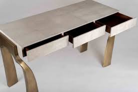 Fluted legs have mounted brass feet. Galaxy Writing Desk Kifu Paris